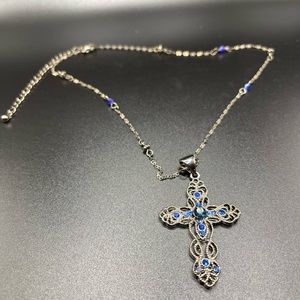 Elegant cross with blue stones and matching chain